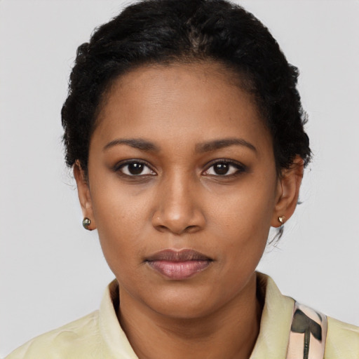 Neutral black young-adult female with short  black hair and brown eyes