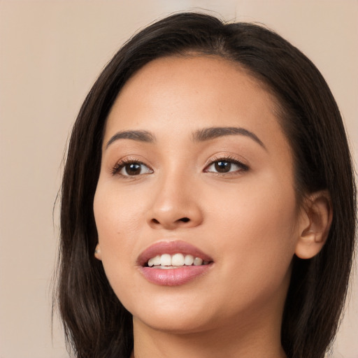 Joyful white young-adult female with long  brown hair and brown eyes