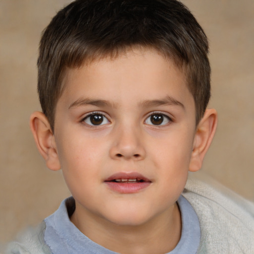 Joyful white child male with short  brown hair and brown eyes