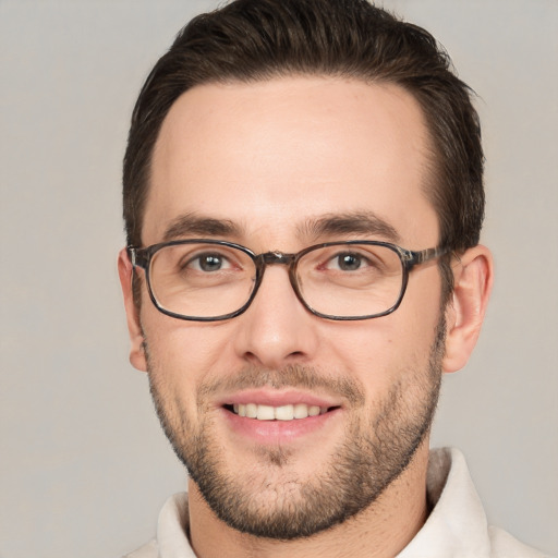 Joyful white young-adult male with short  brown hair and brown eyes