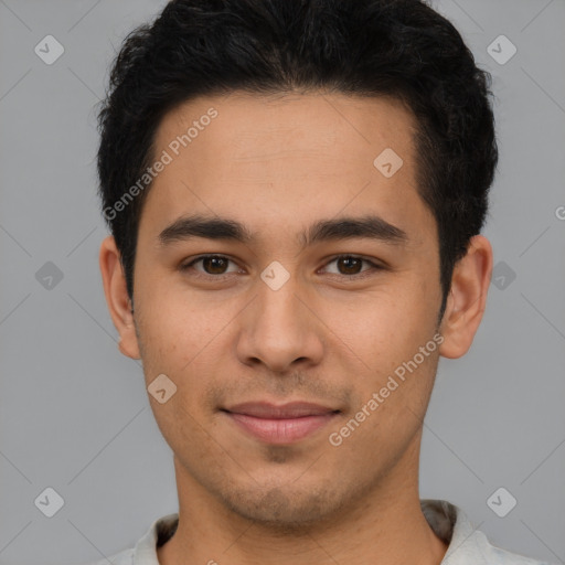 Joyful latino young-adult male with short  brown hair and brown eyes