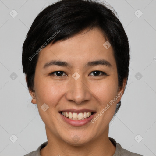 Joyful asian young-adult female with short  brown hair and brown eyes