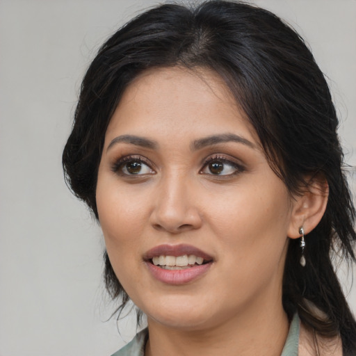 Joyful asian young-adult female with medium  black hair and brown eyes