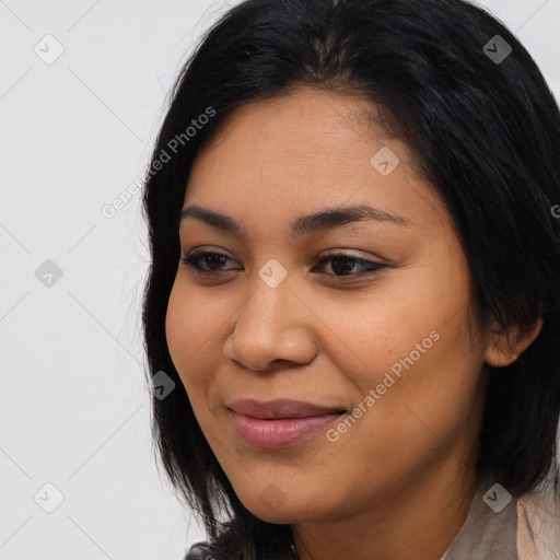 Joyful latino young-adult female with medium  black hair and brown eyes