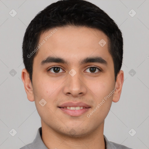 Joyful latino young-adult male with short  brown hair and brown eyes