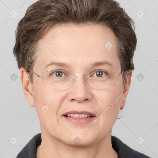 Joyful white adult female with short  brown hair and grey eyes