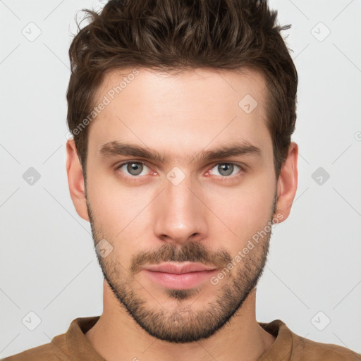 Neutral white young-adult male with short  brown hair and brown eyes