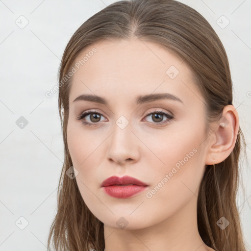 Neutral white young-adult female with long  brown hair and brown eyes