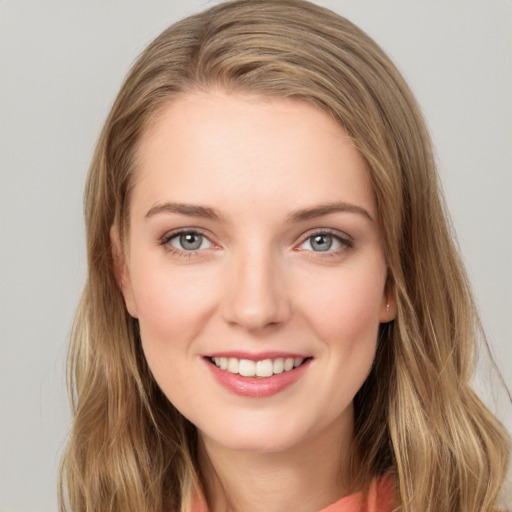 Joyful white young-adult female with long  brown hair and grey eyes