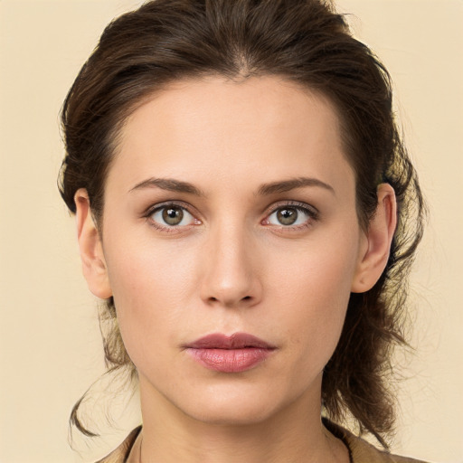 Neutral white young-adult female with medium  brown hair and brown eyes