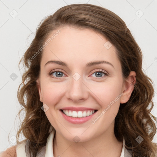 Joyful white young-adult female with long  brown hair and green eyes