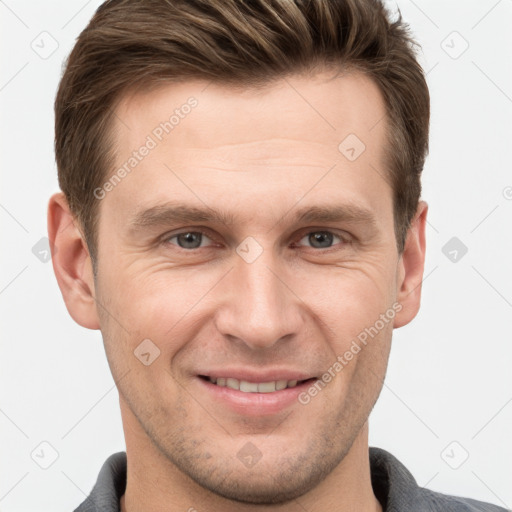 Joyful white adult male with short  brown hair and grey eyes