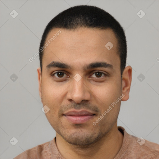 Joyful latino young-adult male with short  black hair and brown eyes