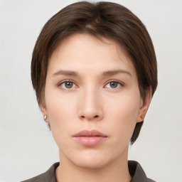 Neutral white young-adult female with short  brown hair and brown eyes