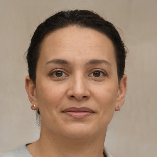 Joyful white adult female with short  brown hair and brown eyes