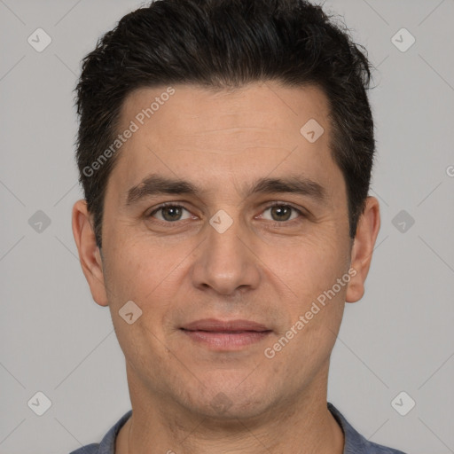 Joyful white adult male with short  brown hair and brown eyes