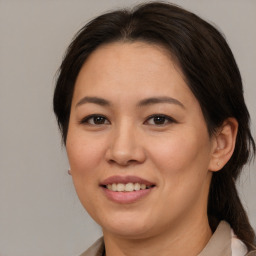 Joyful white adult female with medium  brown hair and brown eyes