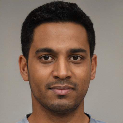 Neutral black young-adult male with short  black hair and brown eyes