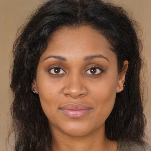 Joyful latino young-adult female with long  brown hair and brown eyes
