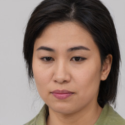 Joyful asian young-adult female with medium  brown hair and brown eyes