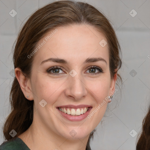 Joyful white young-adult female with medium  brown hair and blue eyes