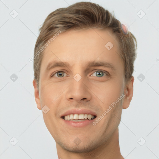 Joyful white young-adult male with short  brown hair and grey eyes