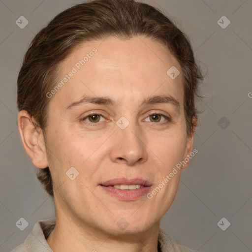 Joyful white adult female with short  brown hair and grey eyes