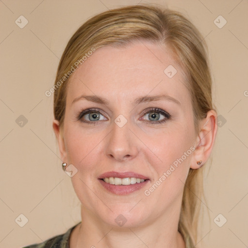 Joyful white young-adult female with long  brown hair and blue eyes