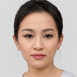 Neutral asian young-adult female with short  brown hair and brown eyes