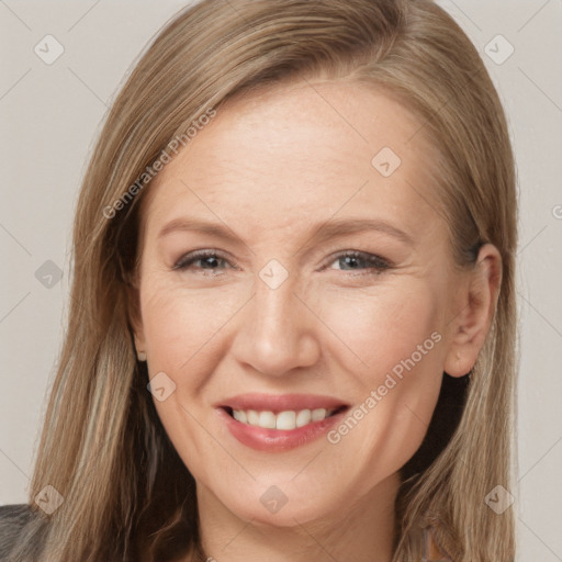 Joyful white adult female with long  brown hair and brown eyes