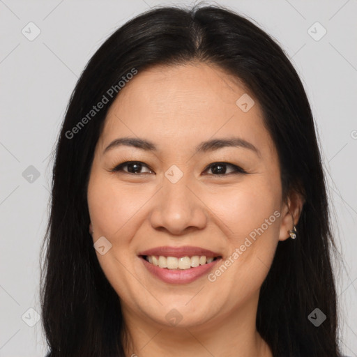 Joyful asian young-adult female with long  brown hair and brown eyes