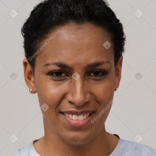 Joyful black adult female with short  brown hair and brown eyes