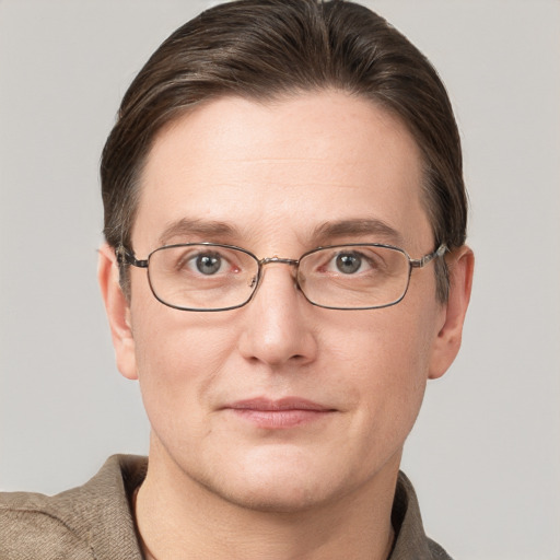 Joyful white adult male with short  brown hair and grey eyes