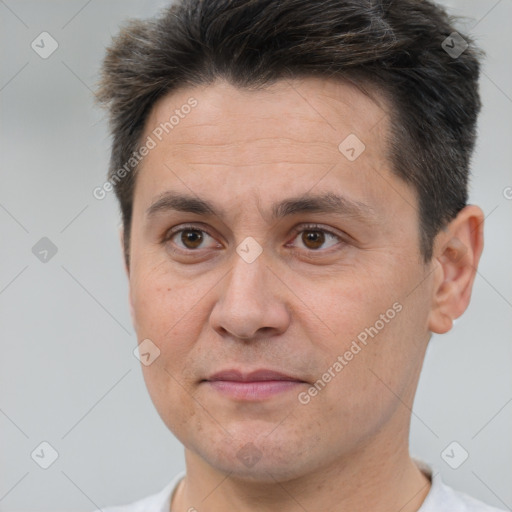 Joyful white adult male with short  brown hair and brown eyes