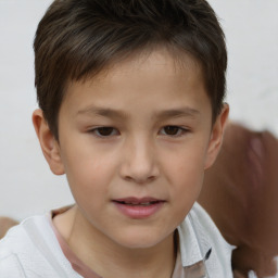 Joyful white child male with short  brown hair and brown eyes