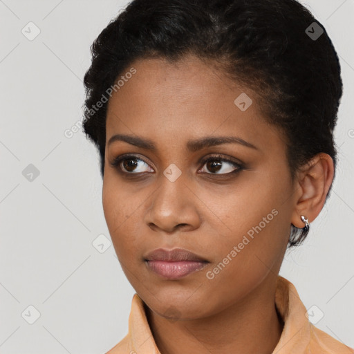 Neutral black young-adult female with short  brown hair and brown eyes