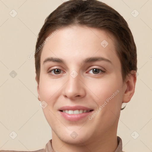 Joyful white young-adult female with short  brown hair and brown eyes