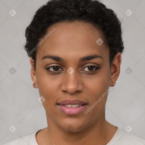 Joyful black young-adult female with short  brown hair and brown eyes