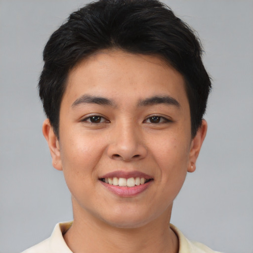 Joyful asian young-adult female with short  brown hair and brown eyes