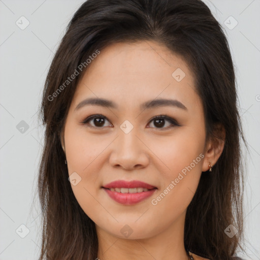 Joyful asian young-adult female with long  brown hair and brown eyes