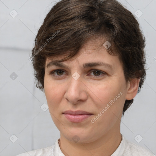 Joyful white adult female with short  brown hair and brown eyes