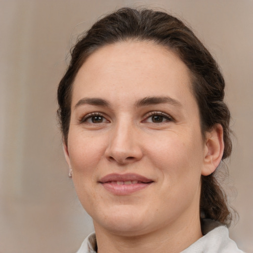 Joyful white young-adult female with medium  brown hair and brown eyes