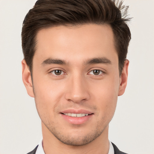 Joyful white young-adult male with short  brown hair and brown eyes