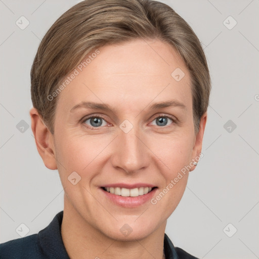 Joyful white adult female with short  brown hair and grey eyes