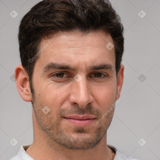 Joyful white adult male with short  brown hair and brown eyes