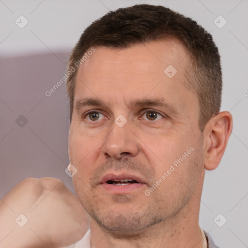 Joyful white adult male with short  brown hair and brown eyes