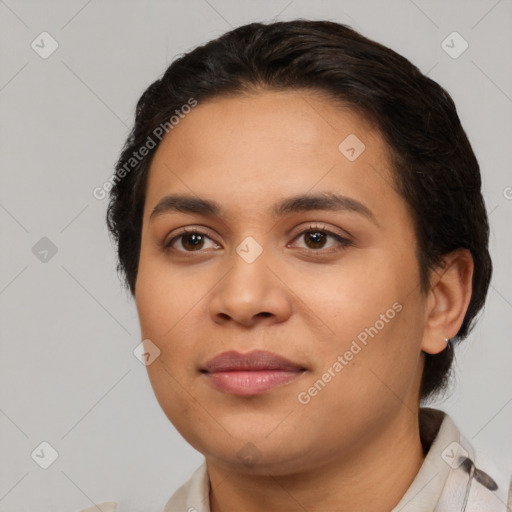 Joyful latino young-adult female with short  black hair and brown eyes