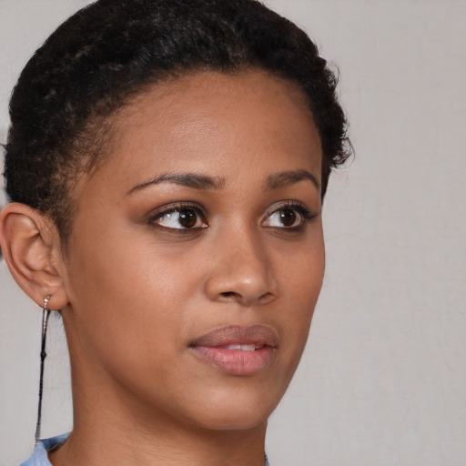 Neutral black young-adult female with short  brown hair and brown eyes