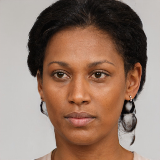 Neutral black young-adult female with short  brown hair and brown eyes
