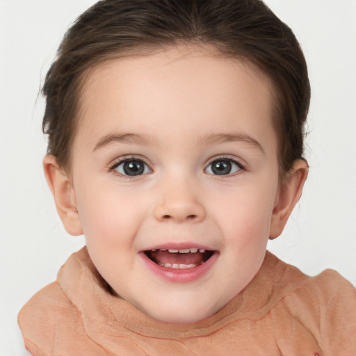 Joyful white child female with short  brown hair and brown eyes